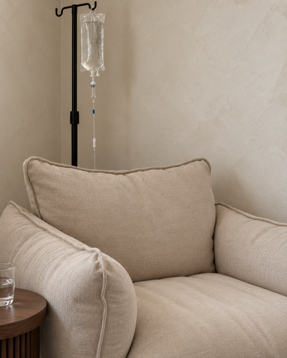 Illustrative concept of the planned Flow & Bloom IV corner, with an oatmeal chair and black IV pole